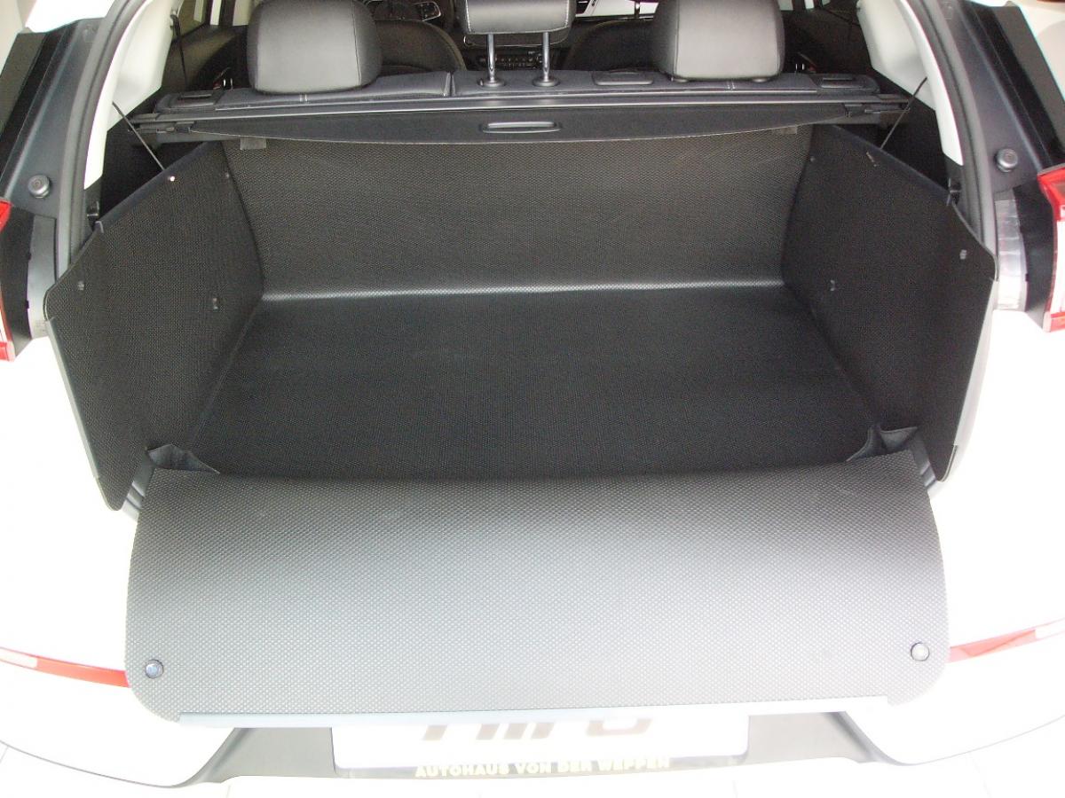 Kofferraumschutz für Kia Niro wie eine Ummantelung des Kofferraums gegen Schmutz und Feuchtigkeit.